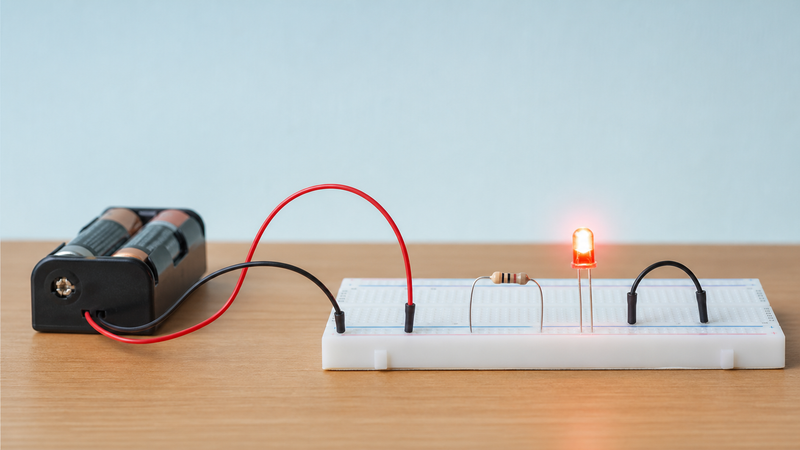 Simple LED breadboard circuit with a series resistor for classroom electronics